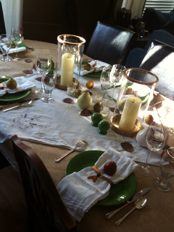 The table cloth is a simple white cloth with a couple yards of burlap